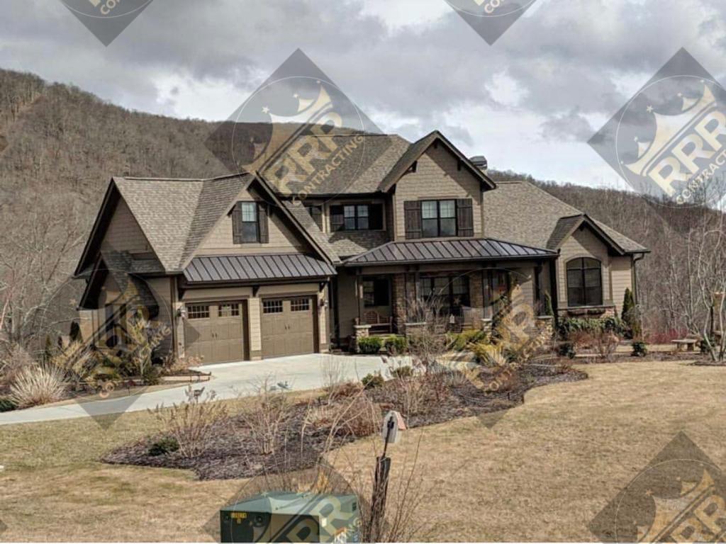 Completed shingle re-roof on a craftsman-style residence