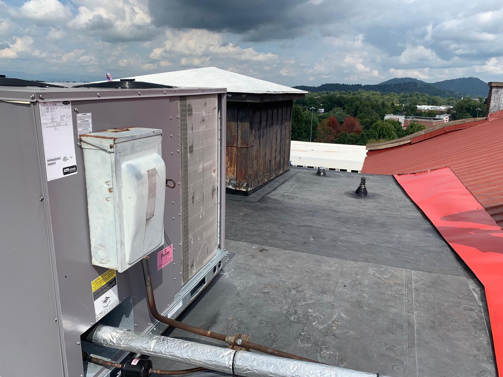 Commercial flat roof with TPO membrane system installation