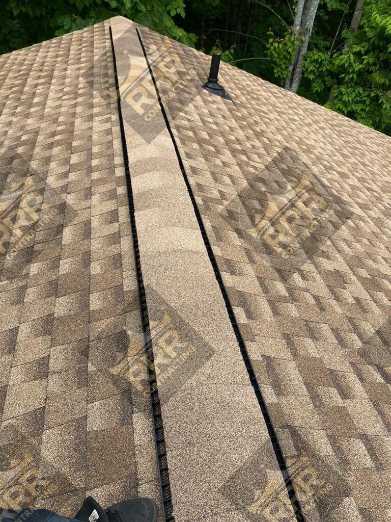 Close-up detail of professional roof ridge and flashing repair work